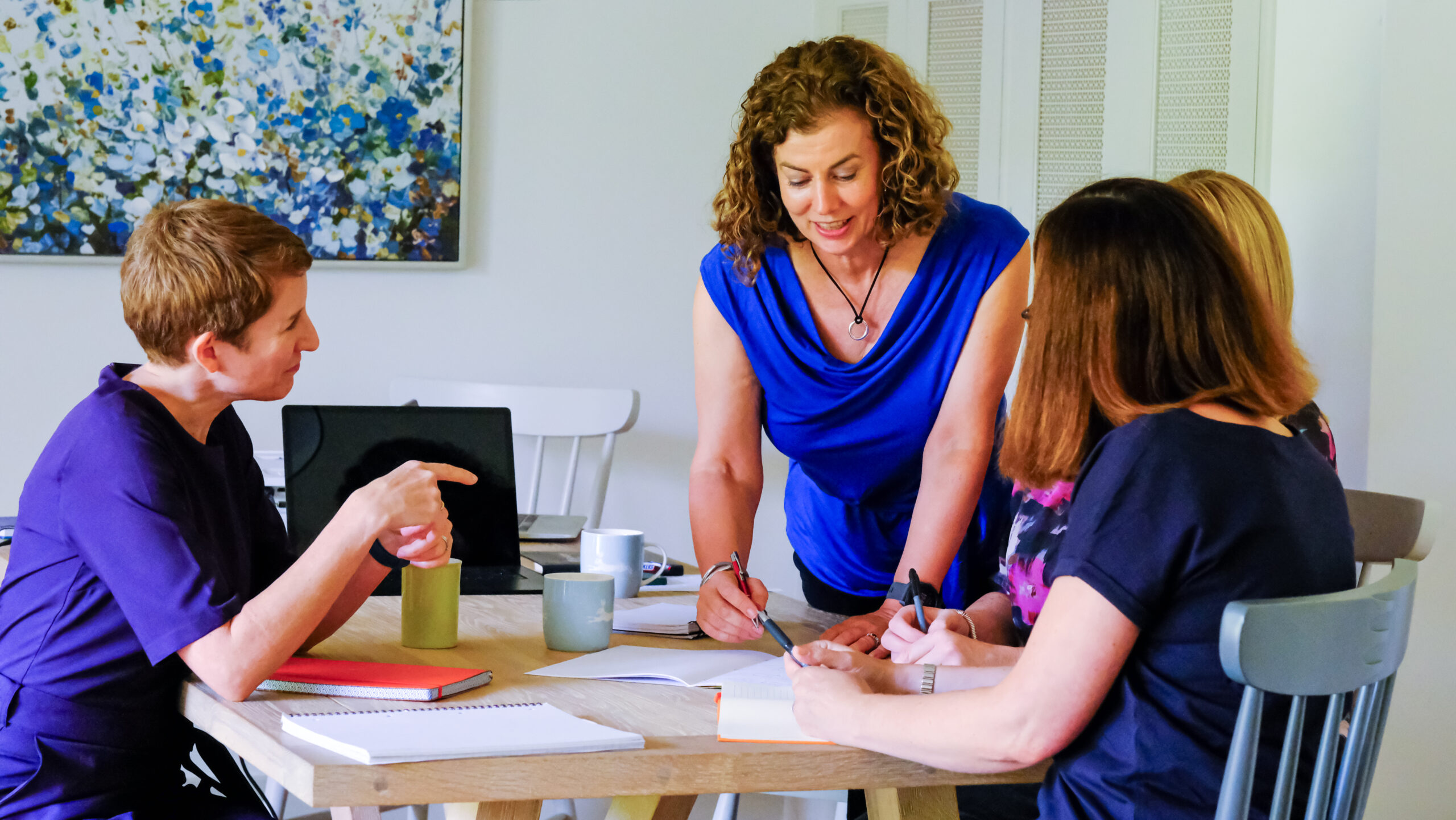 Some of the Ethos Metrics team discussing a client PPC account